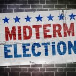 Midterm election poster on a brick wall