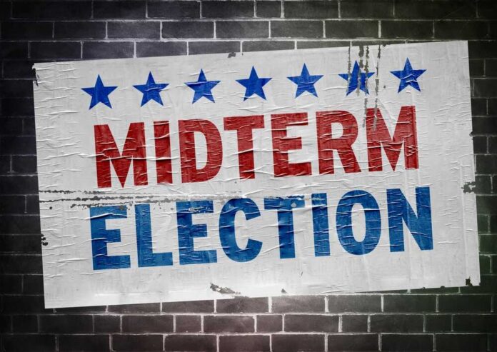Midterm election poster on a brick wall