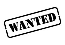 ALERT: Killer Manhunt Explodes Wanted text stamp tilted at an angle