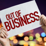 Bankruptcy Stunner – Stores Shut Hands holding an out of business sign