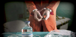 Governor: No Needle, No Innocence Handcuffed person behind Sodium Thiopental and medical equipment.